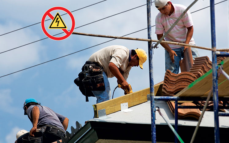 Roofers working unsafely near overhead power lines